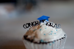 Cupcake Graduation cupcake with "Congrats Grad" topper celebrating high school graduates.